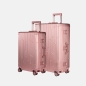 Preview: Zwei GUNDEL Koffer in rosegold, schräg stehend, mit Linienmuster, Teleskopgriffen und TSA-Schlössern vor weißem Hintergrund.
