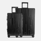 Preview: Zwei GUNDEL Koffer in schwarz, schräg stehend, mit Linienmuster, Teleskopgriffen und TSA-Schlössern vor weißem Hintergrund.
