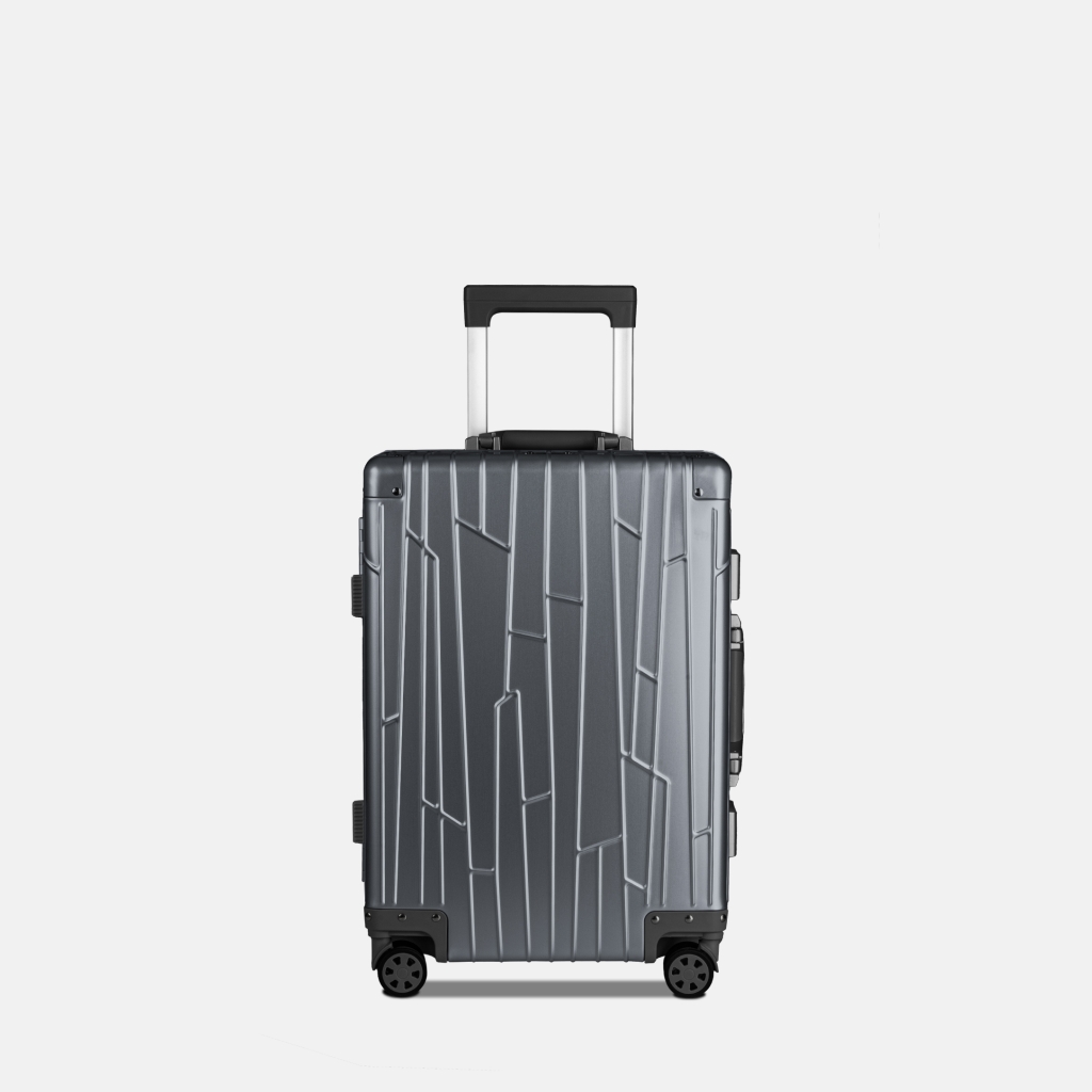 Preview: GUNDEL Aluminiumkoffer in Blau Grau in Frontansicht mit Linienmuster, Teleskopgriff und vier Rollen.