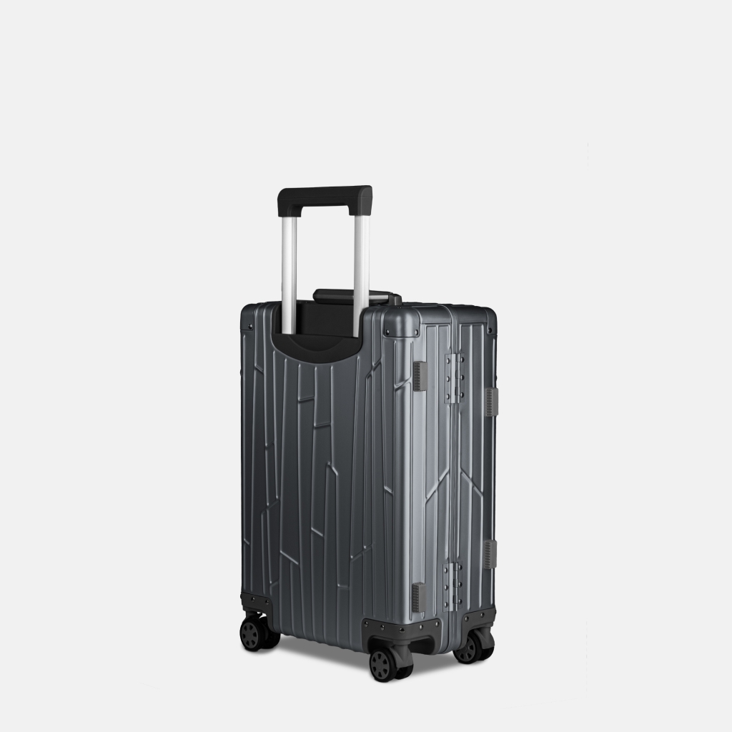 Preview: Seitenansicht des GUNDEL Aluminiumkoffers in Blau Grau mit Teleskopgriff, Scharnieren und vier Rollen.