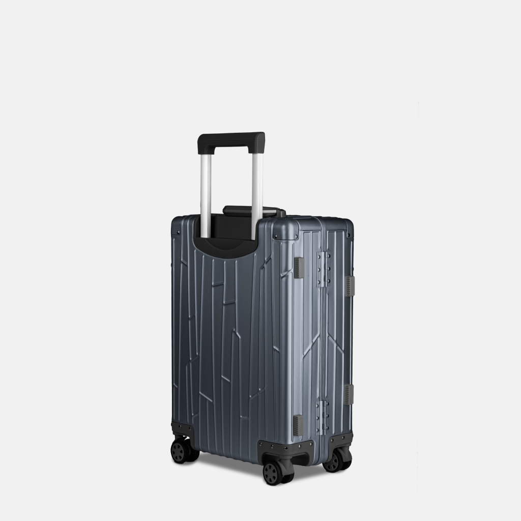 Seitenansicht des GUNDEL Aluminiumkoffers in Blau Grau mit Teleskopgriff, Scharnieren und vier Rollen.