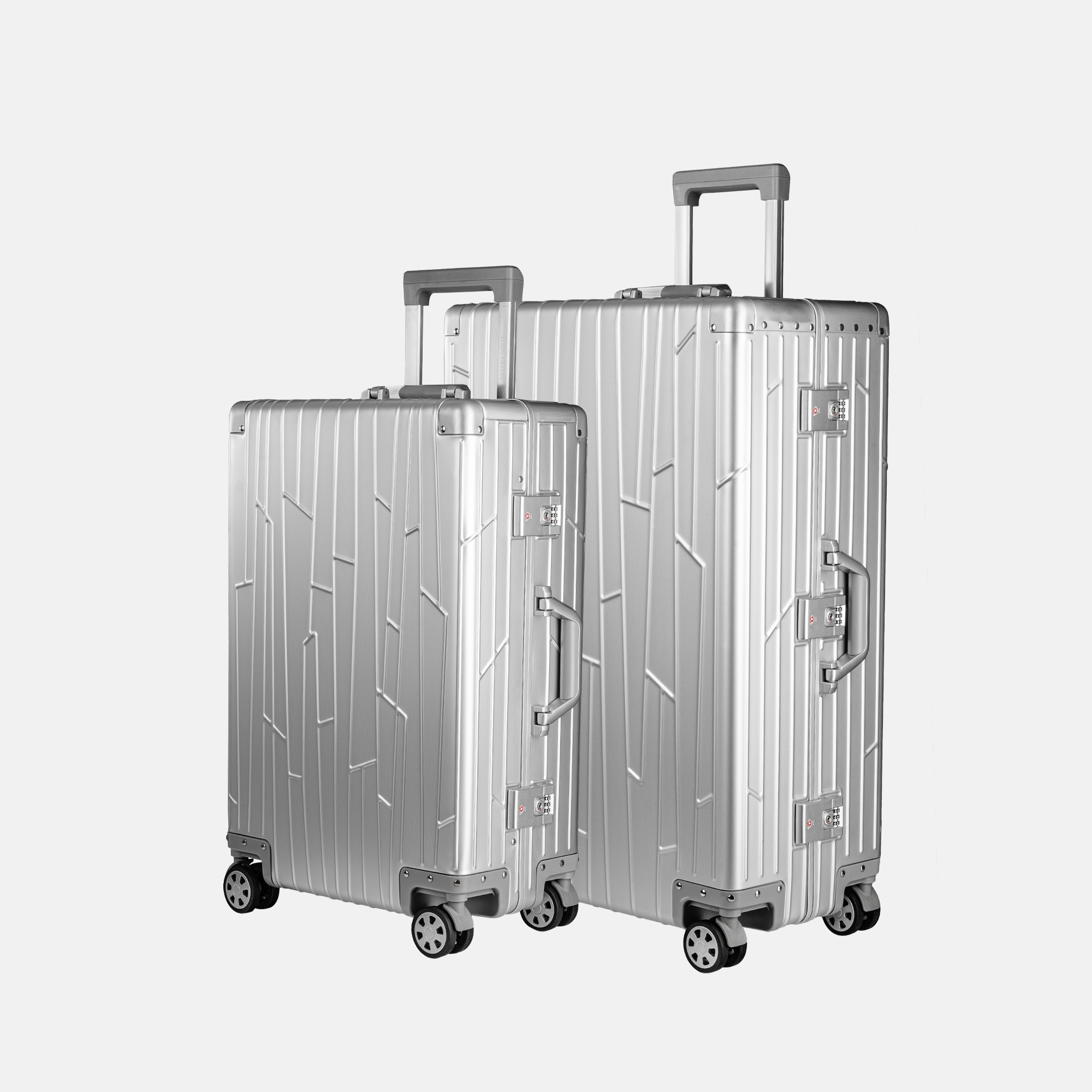 Zwei GUNDEL Koffer in silver, schräg stehend, mit Linienmuster, Teleskopgriffen und TSA-Schlössern vor weißem Hintergrund.