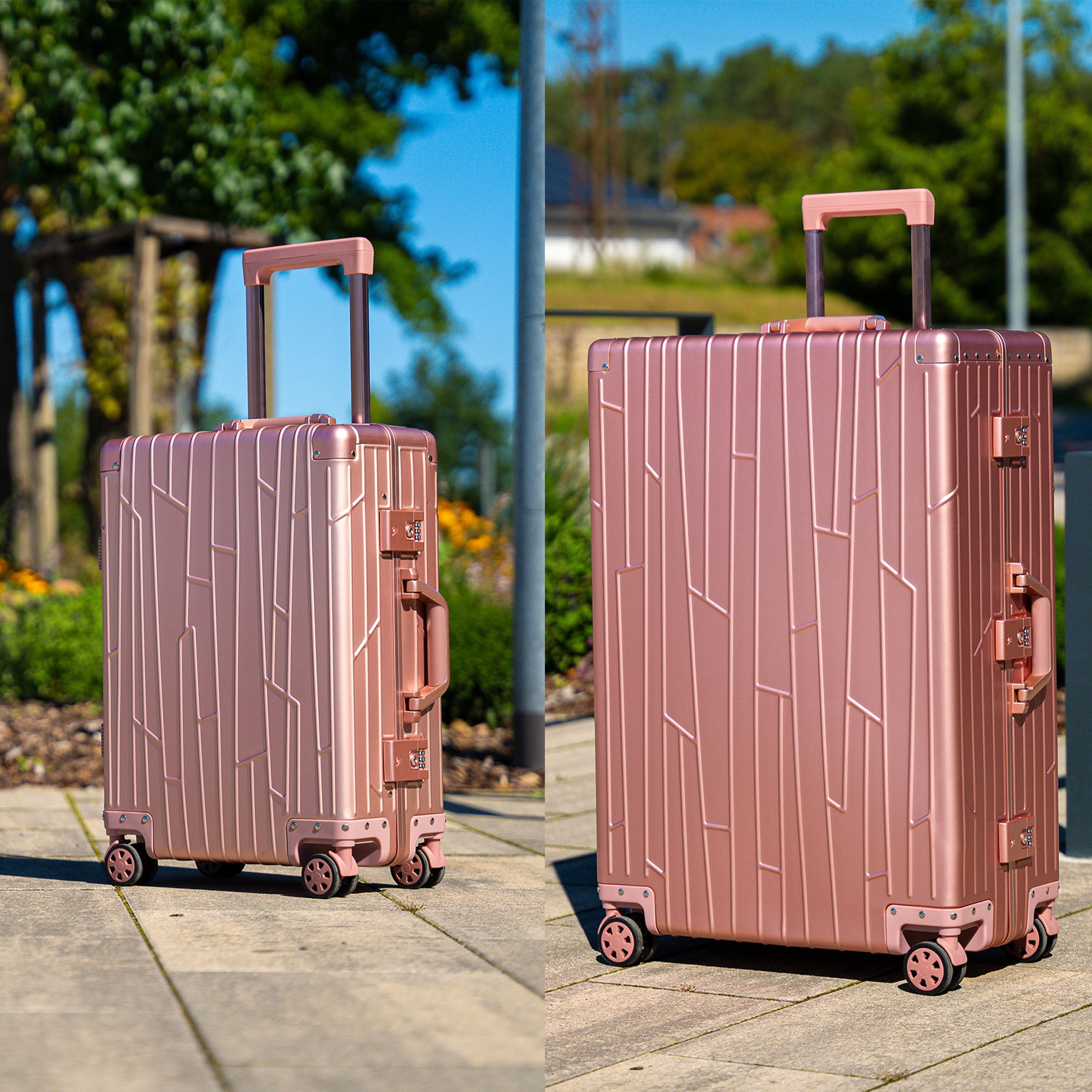 Zwei GUNDEL Koffer in Roségold auf einem gepflasterten Weg mit Grün im Hintergrund.